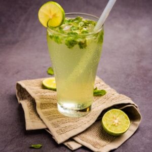 Chilled lime and mint sparkling drink served with ice for a refreshing taste